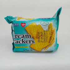 Package of cream crackers in turquoise blue packaging on a white surface, showing the word 'cream crackers' and an image of crackers.