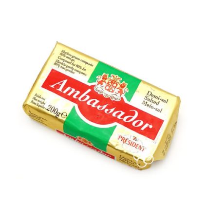 Block of Ambassador brand salted butter in a yellow wrapper with green and red accents and a crest, 200 g