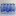 Eight transparent plastic water bottles with blue caps and blue labels arranged in a compact eight-pack.