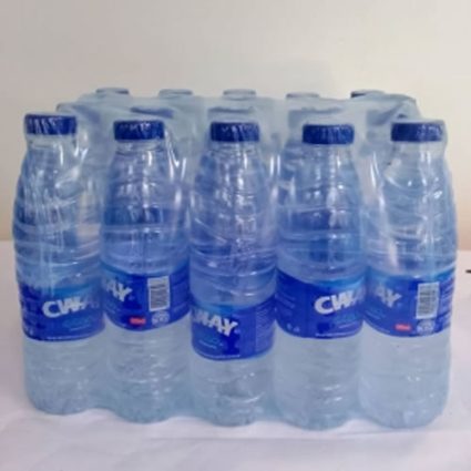 Eight transparent plastic water bottles with blue caps and blue labels arranged in a compact eight-pack.
