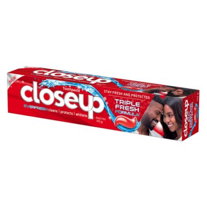 Red Close-Up toothpaste box with large white logo, 'Triple Fresh Formula,' and a smiling couple on the side.