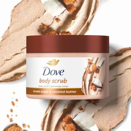 Dove body scrub jar with brown lid and label 'brown sugar & coconut butter' on a swirled beige background.