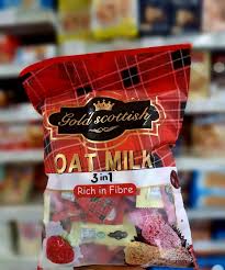 Product bag of Gold Scottish Oat Milk 3 in 1 Rich in Fibre cereal/snack on a store shelf, front label visible with red and black packaging