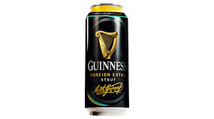 Guinness Foreign Extra Stout beer can with gold harp logo on a black background.