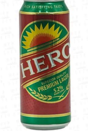 Red can of Hero Premium Lager beer with a green and yellow sunburst label, 5.2% ABV, on a white background