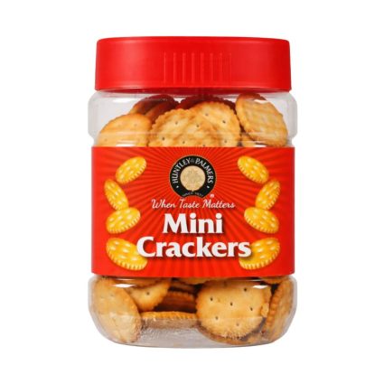 Jar of Huntley's Palmers mini crackers with a red label and red cap, showing round golden crackers inside.