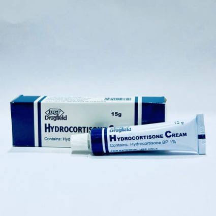 Hydrocortisone cream tube beside a blue-and-white box labeled Hydrocortisone Cream BP 1% (15 g).