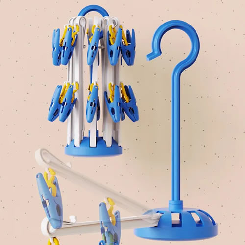 Jiayi Clothes Hangers Pack - Imavug Blue and yellow clothespins clipped to a compact vertical clothes-drying rack beside a blue curved hanger stand on a speckled wall.