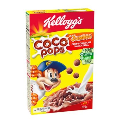 Kellogg's Coco Pops cereal box with a cartoon dog mascot, bright yellow background, milk splash, and 'Jumbo' chocolate maize cereal label.