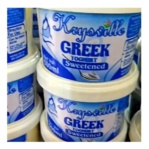 Krysville Greek Yogurt Sweetened 500ml - Imavug Container of sweetened Greek yogurt labeled 'Greek Yogurt Sweetened' on a blue and white lid, stacked among similar tubs