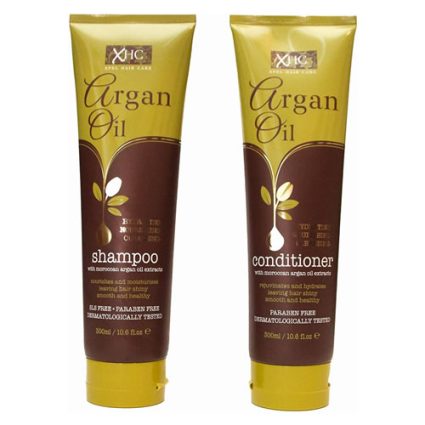 Two Argan Oil bottles, shampoo and conditioner, in yellow and brown packaging on a white background.