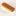 Wooden-handled hairbrush with white bristles for grooming hair (close-up).