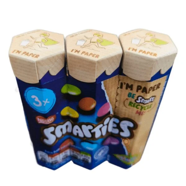 Nestle Smarties 102g - Imavug Three-pack of Smarties candy cartons in blue packaging, displaying '3+' and a recyclable paper wrapper theme.