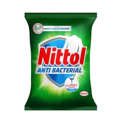 Nittol anti-bacterial multi-use detergent packet with green packaging and bold red logo on a bright badge-looking background.