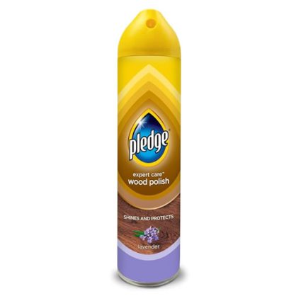 Pledge wood polish spray can with lavender scent, yellow and purple packaging, labeled 'expert care wood polish' and 'shines and protects'
