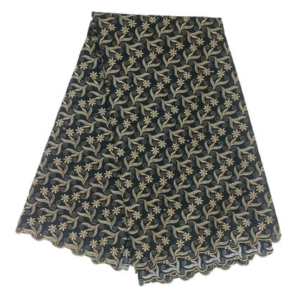 Navy skirt with beige floral and swirl pattern and scalloped hem on a dark background.