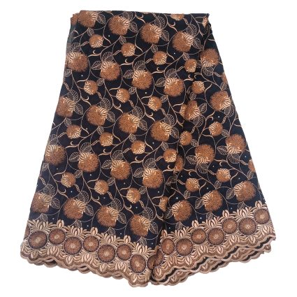 Black skirt with copper floral embroidery and scalloped hem edge.
