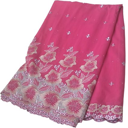 Pink fabric with cream floral embroidery along the hem and small scattered flowers, decorative lace edge reveald along bottom edge of the textile.