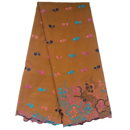 Folded orange-brown fabric heavily embroidered with small pink, blue, and purple flowers scattered across the surface and a decorative scrolling border along the bottom in pink, turquoise, and blue colors.