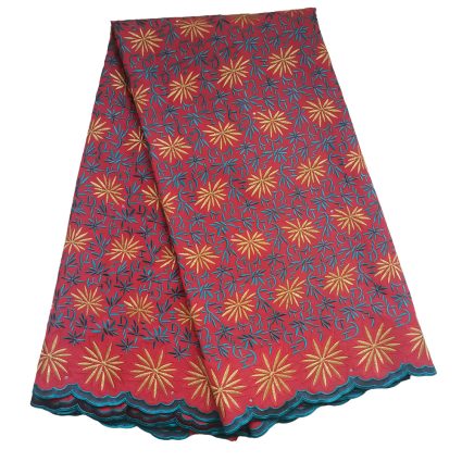 Red fabric with gold starburst floral pattern and teal leaves, finished with teal scalloped edge.