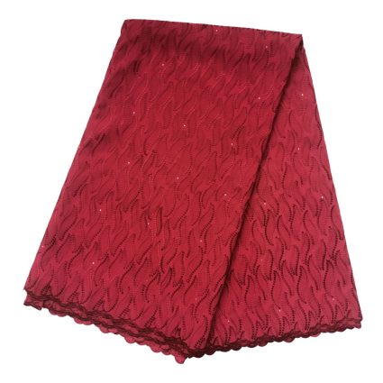 Red lace fabric with a wavy pattern and scalloped edge, folded.