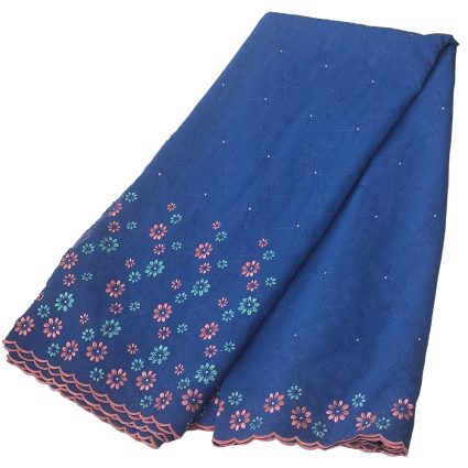 Blue lace fabric with pink and teal embroidered flowers along a scalloped pink hem edge.