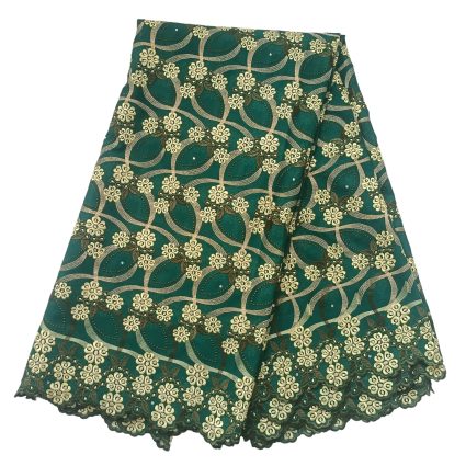 Teal fabric with gold embroidered floral lattice pattern and scalloped edge, folded to show detailed lacework, decorative textile piece.