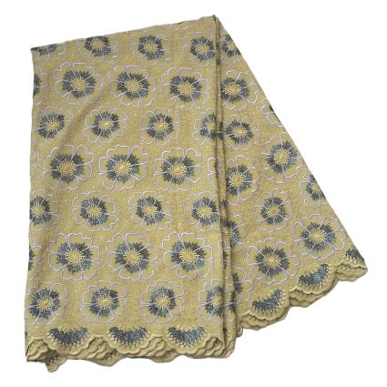 Yellow lace fabric with repeating blue-gray floral motifs and scalloped lace trim.