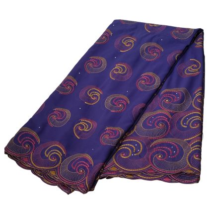 Purple fabric with gold and pink spiral patterns, folded neatly for display (Ankara/printed textile).