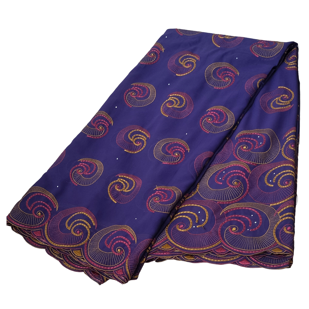 Premium Indigo Violet Swiss Voile Fabric with Gold and Magenta Spiral Swirl Embroidery 5 Yards - Imavug Purple fabric with gold and pink spiral patterns, folded neatly for display (Ankara/printed textile).