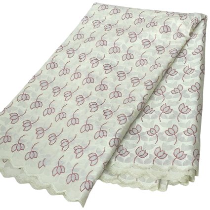 White lace fabric with pink floral embroidery and scalloped edges, folded in layers.