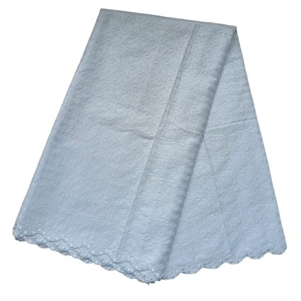 Light blue lace tablecloth with floral pattern and scalloped edge, folded diagonally to show texture and design
