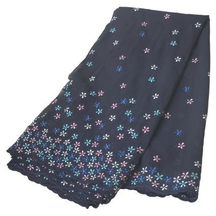 Navy blue skirt with small multicolor flower embroidery along the hem and scalloped lace edge.