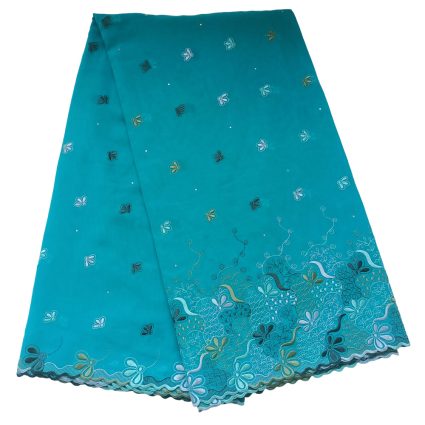 Teal fabric shawl with scattered embroidered flowers and a scalloped lace edge.