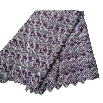 Folded textile with a repeating purple and white square lattice pattern.