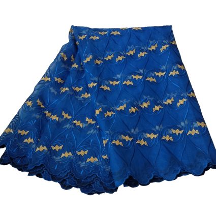 Blue lace fabric with gold bow motifs and scalloped edges, layered for a dress.