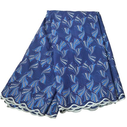 Blue fabric with repeating white leaf-patterns and a scalloped, light-gray border; appears as a folded textile swatch.