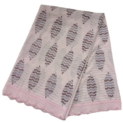 Pink lace-edged textile with a repeating zigzag and floral pattern, folded to show the lace border.