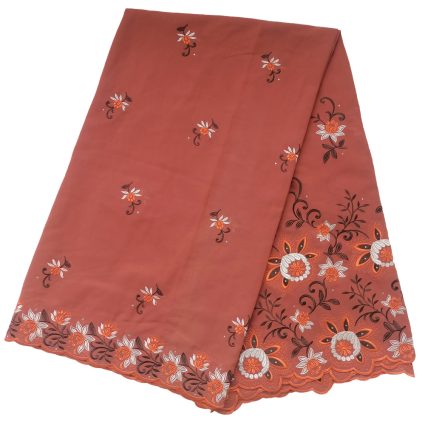 Coral-colored fabric with scattered small white-and-orange floral embroidery and a detailed orange lace border along the edgeui