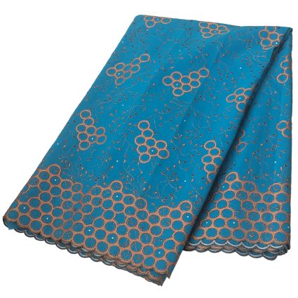 Turquoise fabric with copper circular lace pattern and a scalloped copper-trimmed edge, folded neatly.