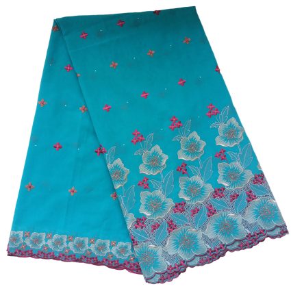 Turquoise fabric with blue floral embroidery along the hem and scattered pink flowers across the surface.