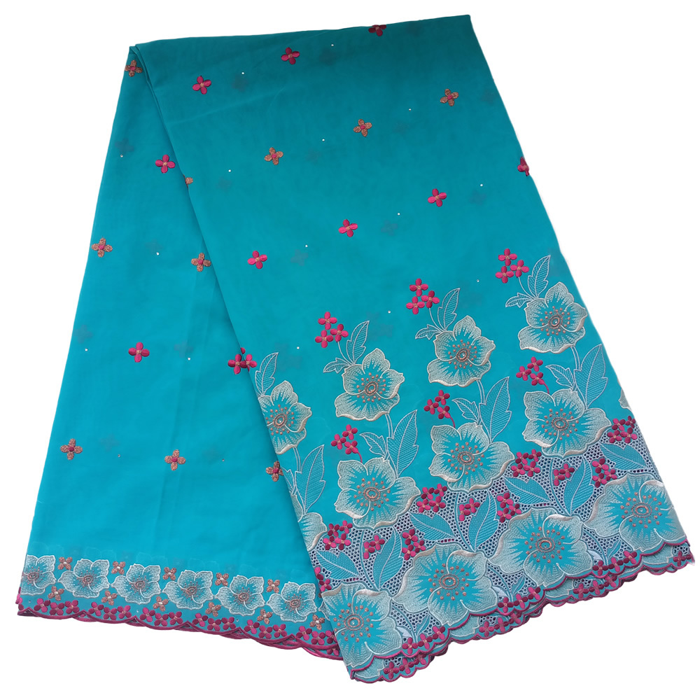 Premium Turquoise Blue Swiss Voile Lace Fabric with Magenta Pink Floral Border Embroidery Scalloped Hem 5 Yards - Imavug Turquoise fabric with blue floral embroidery along the hem and scattered pink flowers across the surface.