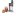 Immersion blender with detachable blade and blending cup, shown with fresh berries and a green apple nearby.