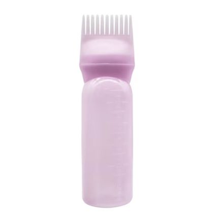 Pink plastic hair dye applicator bottle with a built-in comb-style applicator at the top.