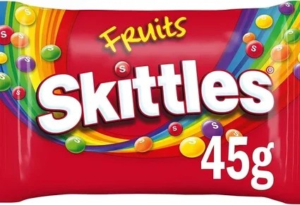 Skittles Fruits candy bag, 45g, with rainbow swoosh and colorful candies on red packaging.