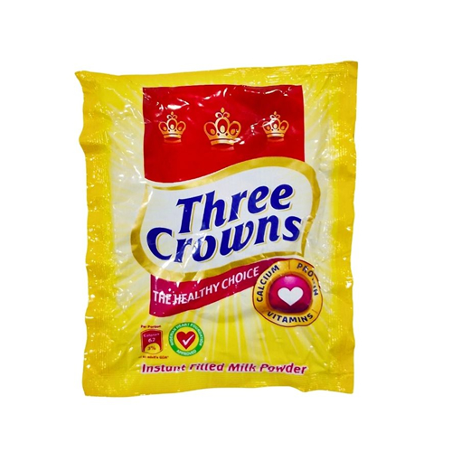 Three Crowns Milk Sachet 12g - Imavug Yellow bag of Three Crowns instant full-cream milk powder with red crown emblem and blue Three Crowns logo on a white background.