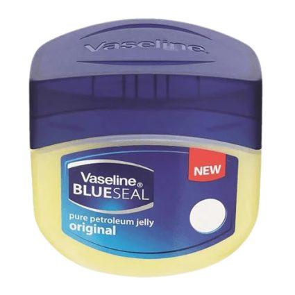 Vaseline Blue Seal original petroleum jelly tub with purple lid and yellow base, featuring a NEW badge on the label.