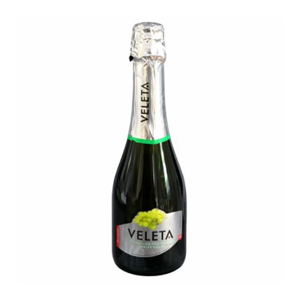 Bottle of Veleta sparkling wine with silver foil cap and green accent band, label featuring grapes
