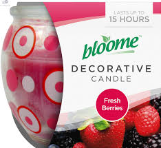 Bloom decorative candle in a frosted glass jar with pink circles; packaging shows the scent 'Fresh Berries'