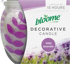 Decorative candle in a glass jar with purple leaf pattern and lavender-themed packaging, Wild Lavender scent.